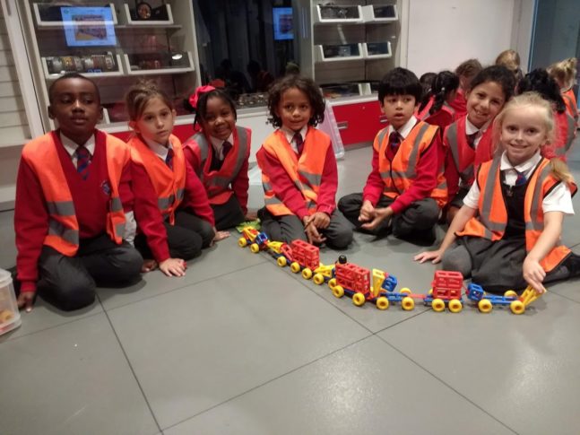 Picture of children with a toy train